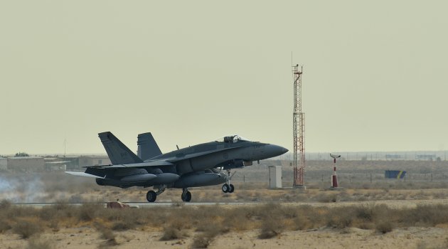 A Canadian Armed Forces CF-18 Fighter jet arrives at the Canadian Air Task Force Flight Operations Area in Kuwait on October 28, 2014 in this Canadian Forces handout photo received October 29, 2014. The jets are part of the Canadian Armed Forces' contribution to coalition assistance to security forces in the Republic of Iraq who are fighting against the Islamic State of Iraq and the Levant (ISIL). REUTERS/Canadian Forces Combat Camera, DND/Handout (KUWAIT - Tags: POLITICS MILITARY) FOR EDITORIAL USE ONLY. NOT FOR SALE FOR MARKETING OR ADVERTISING CAMPAIGNS. THIS IMAGE HAS BEEN SUPPLIED BY A THIRD PARTY. IT IS DISTRIBUTED, EXACTLY AS RECEIVED BY REUTERS, AS A SERVICE TO CLIENTS