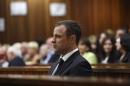 Olympic and Paralympic track star Pistorius listens   to Judge Masipa deliver her verdict at the North Gauteng High Court in Pretoria