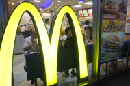 Customers have a meal at a McDonald's restaurant in Tokyo, Tuesday, July 22, 2014. McDonald’s Corp. said Tuesday its restaurants in Japan stopped using chicken from the Shanghai company, Husi Food Co. McDonald’s said Husi provided about 20 percent of the meat of expired chicken used in its chicken nuggets in Japan. (AP Photo/Shizuo Kambayashi)