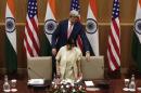 U.S. Secretary of State Kerry pulls a chair for India's External Affairs Minister Swaraj upon their arrival to address a joint news conference New Delhi