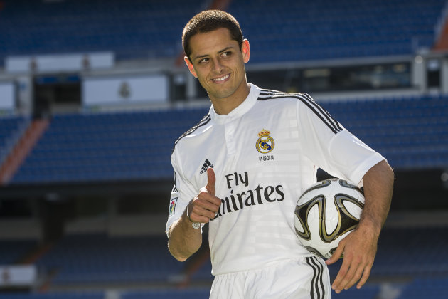 Mexico's international soccer player Javier Hernandez 'Chicharito', poses during his official presentation at the Santiago Bernabeu stadium in Madrid, Spain, Monday, Sept. 1, 2014, after signing for Real Madrid. (AP Photo/Andres Kudacki)