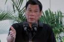 Philippines President Rodrigo Duterte gestures during   a news conference upon his arrival from Vietnam trip at the International Airport   in Davao city