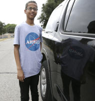 Ahmed Mohamed, the 14-year-old who was arrested at MacArthur High School after a homemade clock he brought to school was mistaken for a bomb, smiles before before leaving his family's home Wednesday, Oct. 21, 2015, in Irving, Texas. Mohamed will soon be leaving Irving with his family to move to the Middle Ease to attend school. Mohamed's family said in a statement Tuesday that they've accepted a foundation's offer to pay for his high school and college in Doha, Qatar. (AP Photo/LM Otero)