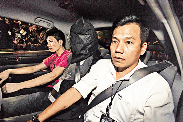 東九龍總區刑事總部專案組昨出動，一男子（中）涉嫌洗黑錢被捕。（劉定安攝）