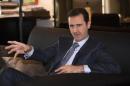 Syria's President Bashar al-Assad speaks during   an interview with French magazine Paris Match,in Damascus