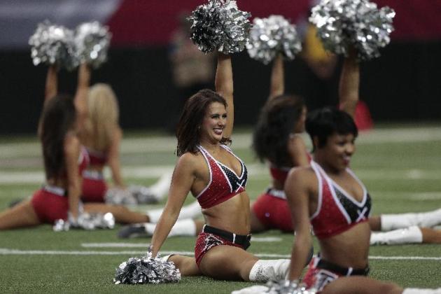 Atlanta Falcons cheerleaders perform before the first half of an NFL football game against the New Orleans Saints, Sunday, Sept. 7, 2014, in Atlanta. (AP Photo/John Bazemore)