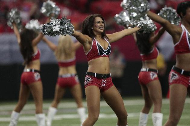 Atlanta Falcons cheerleaders perform before the first half of an NFL football game against the New Orleans Saints, Sunday, Sept. 7, 2014, in Atlanta. (AP Photo/John Bazemore)