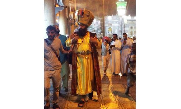 SHOWMAN: The man in a medieval dress draws everyone's attention in the Grand Mosque