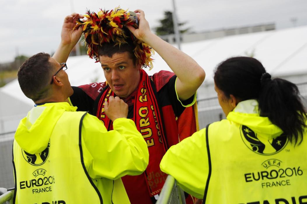 Fan are searched as they enter the stadium before the match