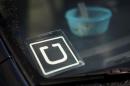 An Uber car is seen parked with the driver's lunch left on the dashboard in Venice, Los Angeles