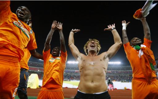 Ivory Coast's head coach Renard celebrates with his players after winning the African Nations Cup final soccer match against Ghana in Bata