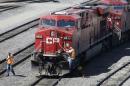 A Canadian Pacific Railway crew works on their train at the CP Rail yards in Calgary