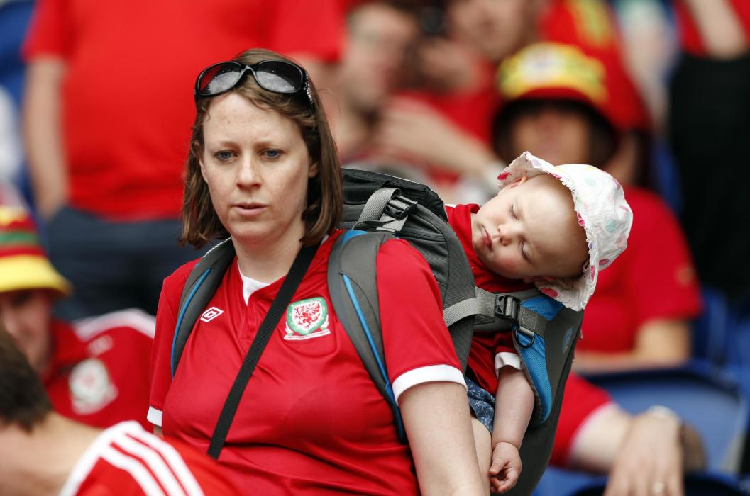 A Wales fans with a baby before the match