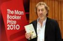 Howard Jacobson, one of the shortlisted authors for the 2010 Man Booker Prize, poses with his book "The Finkler Question", in London