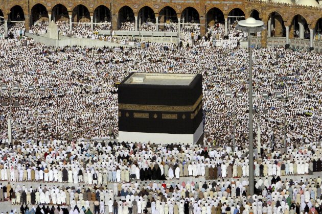 Tens of thousands of Muslim pilgrims performing the Hajj attend the afternoon prayers around the Kaaba.