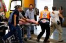 An Israeli wounded in what the Israeli army said was   a stabbing attack in the West Bank Jewish settlement of Kiryat Arba, is evacuated   to a hospital in Jerusalem