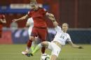 Germany's Simone Laudehr (6) and United States' Morgan Brian (14) battle for the ball during the first half of a semifinal in the Women's World Cup soccer tournament, Tuesday, June 30, 2015, in Montreal, Canada. (Ryan Remiorz/The Canadian Press via AP)