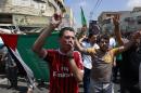 Palestinian supporters of Hamas chant slogans against the Israeli military action in Gaza, during a demonstration in the West Bank city of Jenin on Friday, Aug. 22, 2014. (AP Photo/Mohammed Ballas)