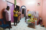 Thiyagarajan’s wife Parvathi (left) and family members mourn their loss at his residence in Taman Tapah Baru. — Picture by Marcus Pheong