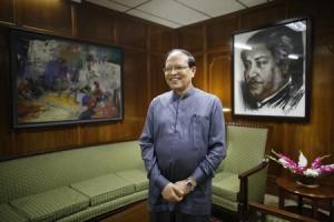 Bangladesh's central bank Governor Atiur Rahman poses inside his office in Dhaka