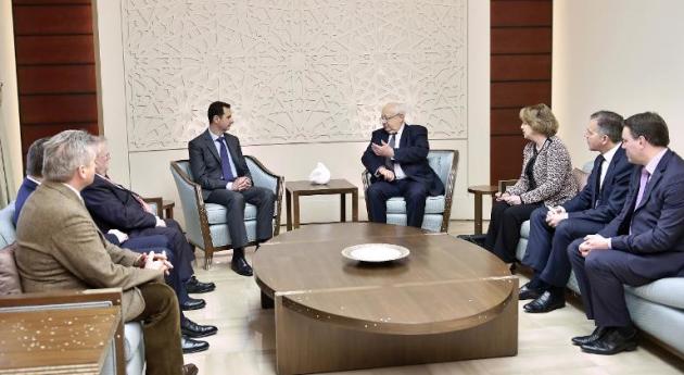 Picture released by the Syrian Arab News Agency (SANA) on February 25, 2015 shows Syrian President Bashar al-Assad (C-L) meeting with French socialist senator, Jean-Pierre Vial (C-R), and French parliamentarians in Damascus