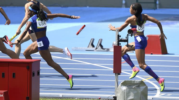 Allyson Felix of USA fails to hand over the baton to English Gardner during the women's 4 x 100m relay round 1 race at the Olympic Stadium on August 18, 2016. (REUTERS/Dylan Martinez)