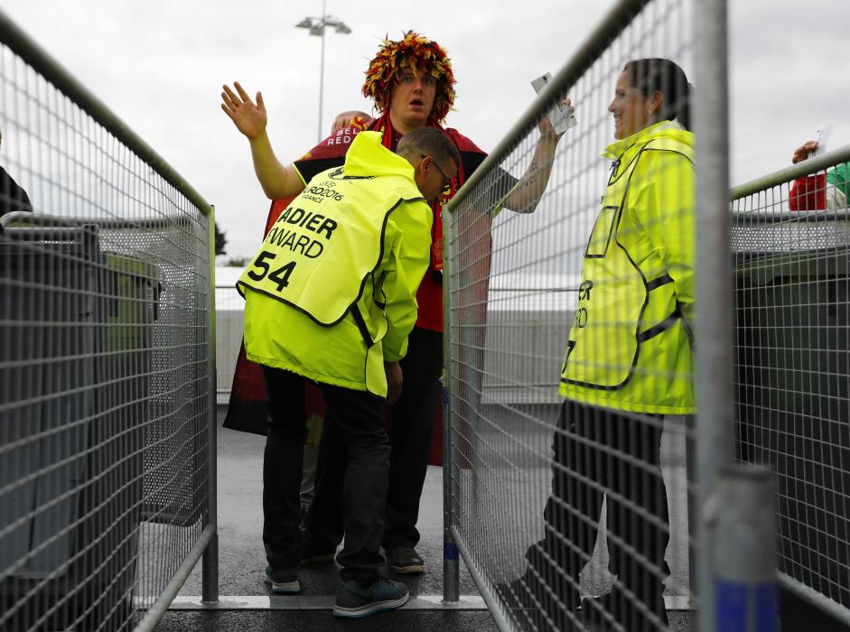 Fan are searched as they enter the stadium before the match