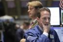 Traders work on the floor of the New York Stock   Exchange