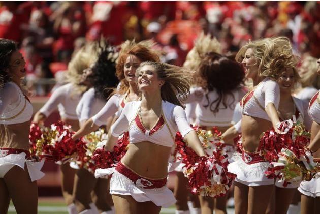 Kansas City Chiefs cheerleaders entertain the crowd in the first half of an NFL football game against the Tennessee Titans in Kansas City, Mo., Sunday, Sept. 7, 2014. (AP Photo/Charlie Riedel)