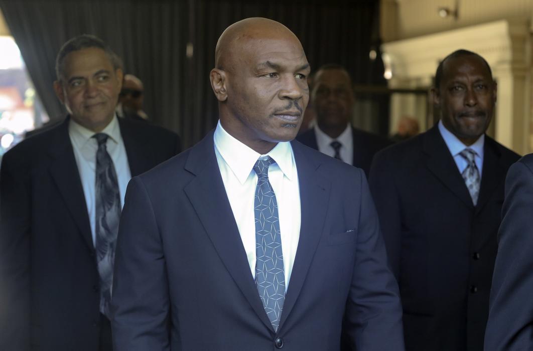 Pallbearer Mike Tyson leaves the funeral home to attend Muhammad Ali's memorial in Louisville