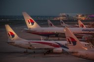 Ground staff prepare Malaysia Airlines planes for departure at Kuala Lumpur International Airport in Sepang on July 30, 2014