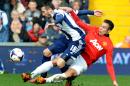 Manchester United's Robin van Persie tackles West Brom's Morgan Amalfitano during the English Premier League soccer match between West Bromwich Albion and Manchester United at The Hawthorns Stadium in West Bromwich, England, Saturday, March 8, 2014. (AP Photo/Rui Vieira)