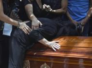 The mother of murdered Mexican photographer Ruben Espinosa cries over his coffin upon arrival at the Dolores cemetery in Mexico City, on August 3, 2015