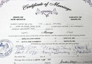 FILE - This photo taken on Monday, May 12, 2014, shows the certificate of marriage presented to Kathy Chambery, and her partner, Marilyn Haring of 23 years, after they were married at Magistrate Court in Santa Fe, N.M. More than half of marriage licenses issued from Santa Fe County in the last year have gone to same-sex couples. Data from the Santa Fe County Clerk's Office shows that the number of licenses given out doubled and 55 percent went to same-sex couples. New Mexico became the 17th state to legalize same-sex marriage on Dec. 19, through a unanimous ruling by the state Supreme Court. (AP Photo/The Santa Fe New Mexican, Jane Phillips)