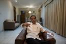 File photo of Indonesia's presidential candidate Joko "Jokowi" Widodo gesturing during an interview with Reuters in Jakarta