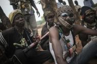 Anti-Balaka militia members rest on the outskirts of Bambari, on July 31, 2014