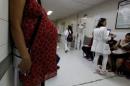 Pregnant woman waits for a routine general checkup,   which includes Zika screening, at the maternity ward of the Hospital Escuela in   Tegucigalpa