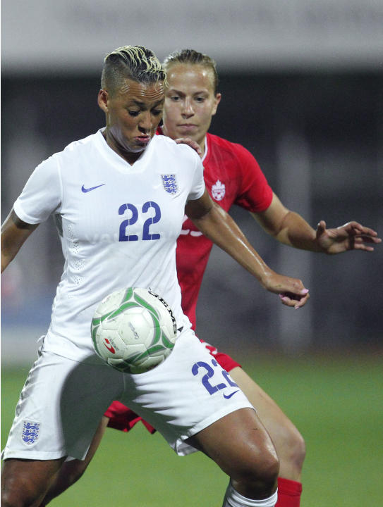 Rebecca Quinn, rear, of Canada challenges for the ball ...