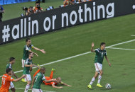 Mexico's Rafael Marquez, left, gestures after fouling Netherlands' Arjen Robben inside the penalty zone during the World Cup round of 16 soccer match between the Netherlands and Mexico at the Arena Castelao in Fortaleza, Brazil, Sunday, June 29, 2014. (AP Photo/Themba Hadebe)