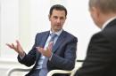 Syrian President Assad speaks during a meeting with   Russian President Putin at the Kremlin in Moscow