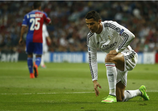 Real's Cristiano Ronaldo pauses during the Champions League Group B soccer match between Real Madrid and Basel at the Santiago Bernabeu stadium in Madrid, Spain, Tuesday, Sept. 16, 2014. (AP Photo/And