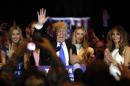 Republican U.S. presidential candidate and businessman Donald Trump waves after speaking to supporters following the results of the Indiana state primary at Trump Tower in Manhattan, New York