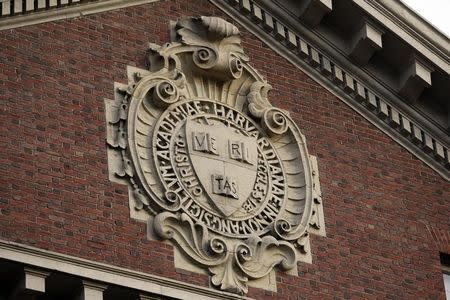 A seal hangs over a building at Harvard University in Cambridge, Massachusetts November 16, 2012. REUTERS/Jessica Rinaldi