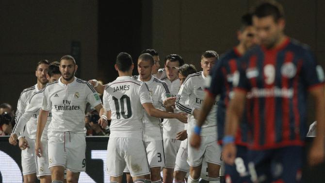 Real Madrid’s Gareth Bale celebrates with teammates scoring his side's 2nd goal during the final soccer match between Real Madrid and San Lorenzo at the Club World Cup soccer tournament in Marrakech, Morocco, Saturday, Dec. 20, 2014. (AP Photo/Christophe Ena)