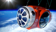 This artist rendering provided by World View Enterprises shows the World View Voyager pressurized space capsule that will be transported to the edge of space. The Arizona company says it has successfully completed the first scale test flight of a high-altitude balloon and capsule being developed to take tourists to the edge of space. World View Enterprises of Tucson said Tuesday June 24, 2014 that it launched the flight last week from Roswell, N.M. CEO Jane Poynter says the system broke the world record for highest parafoil flight, lifting a payload one-tenth of what is planned for passenger flight to 120,000 feet. (AP Photo/World View Enterprises)