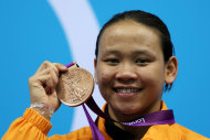 LONDON, ENGLAND - AUGUST 09: Bronze medallist Pandelela Pamg of Malaysia poses on the podium during the medal ceremony for the Women's 10m Platform Diving Final on Day 13 of the London 2012 Olympic Games at the Aquatics Centre on August 9, 2012 in London, England. (Photo by Clive Rose/Getty Images)