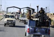 Un convoy de soldados iraquíes llega a Tikrit, Irak, hoy, jueves 26 de marzo de 2015.
