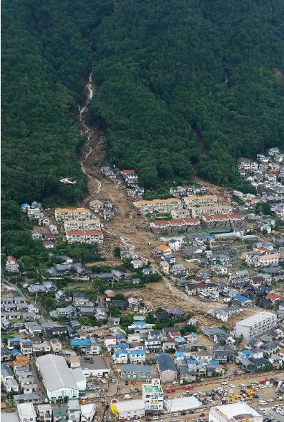 An aerial view shows the damage caused by a landslide after heavy rains hit the city of Hiroshima, western Japan, on August 20, 2014