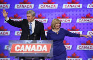 Conservative leader Stephen Harper and his wife Laureen wave to supporters on Monday, Oct. 19, 2015, in Calgary, Alberta. Canadians voted for a sharp change in their government Monday, returning a legendary name for liberals, Trudeau, to the prime minister's office and resoundingly ending Harper's near-decade in office. (Jeff McIntosh/The Canadian Press via AP) MANDATORY CREDIT