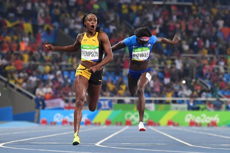 Jamaica's Elaine Thompson (L) crosses the finish line next to bronze medallist USA's Tori Bowie to win the women's 200m final during the Rio 2016 Olympic Games, on August 17 (AFP Photo/Olivier Morin)